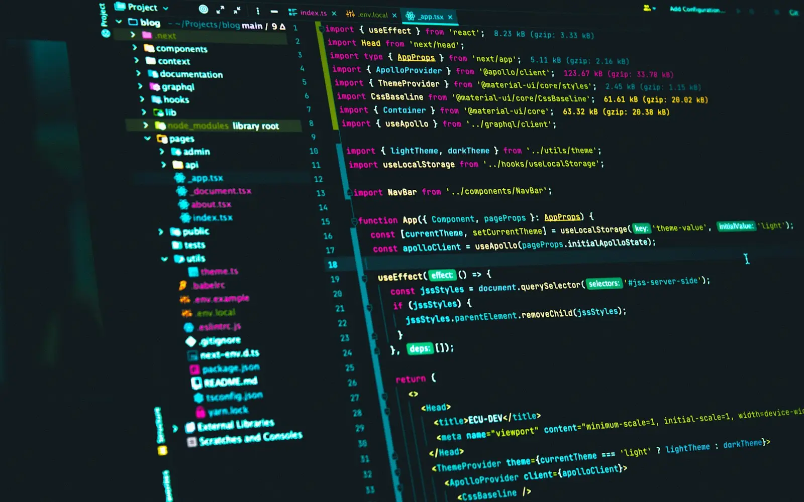 React source code in a code editor with a file tree on a dark monitor